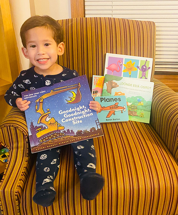 boy reading from book pack